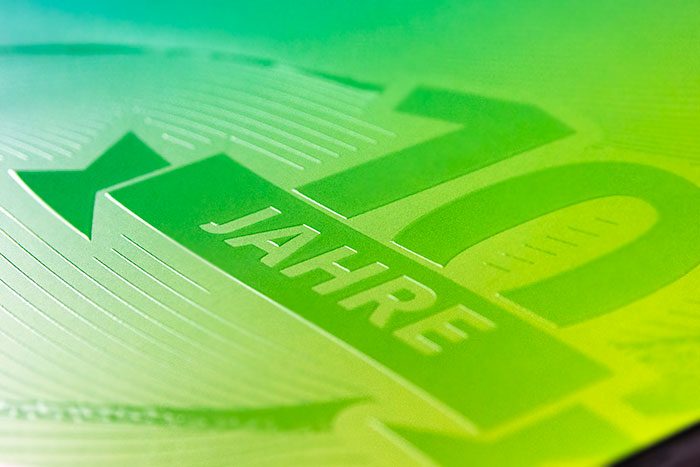 Veredelung mit UV-Relieflack bei printoo